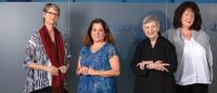 Four nurses standing next to each other